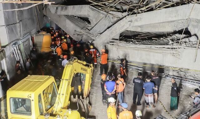 Indonesia School Collapse: Rescuers Race to Find Dozens Trapped in East Java Rescue workers and police search through concrete rubble at the collapsed Al-Khoziny Islamic Boarding School in Sidoarjo, East Java, Indonesia.